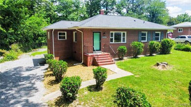 View of front of property featuring a front yard