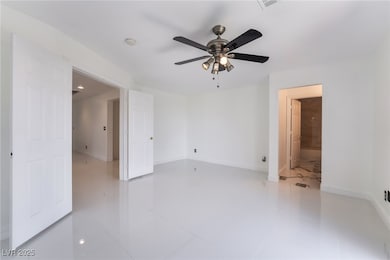 Empty room featuring light tile patterned flooring