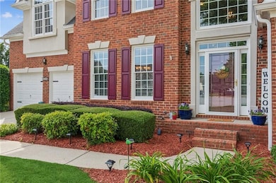 View of exterior entry featuring brick siding and 