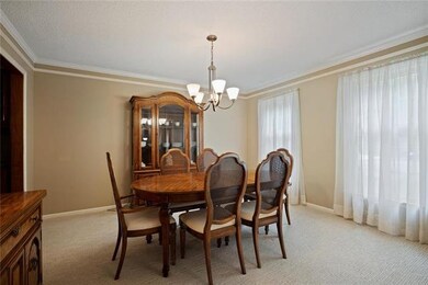 The formal dining room features brand new designer