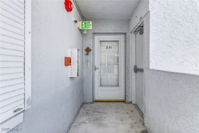 Property entrance featuring stucco siding