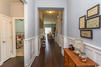 Hallway with dark colored carpet