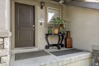 Doorway to property with stucco siding