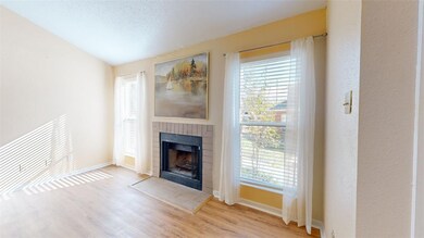 Unfurnished living room featuring a textured ceili