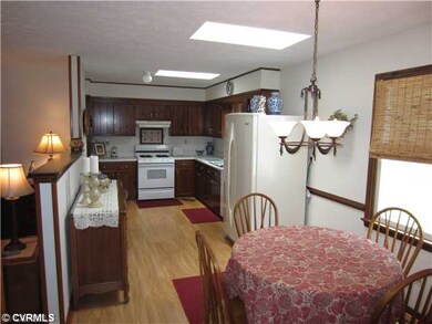 Kitchen - Inviting eat-in kitchen featuring custom