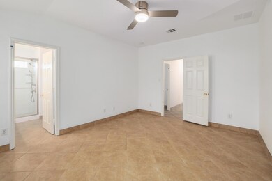Unfurnished bedroom featuring light tile patterne