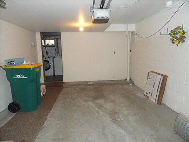 Large garage with automatic garage door opener. La