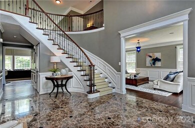 Curved staircase w/Wrought iron Rails.
