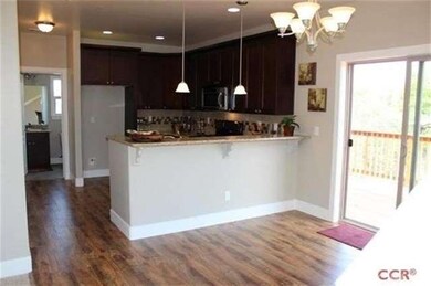 Full view of kitchen looking to end of hall, 1/2 b