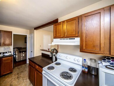 Kitchen has range, washer, dryer and refrigerator