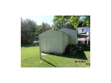 attached to the garage is a spacious garden shed