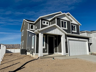 View of front facade featuring board and batten siding, a garage, driveway, and a mountain view