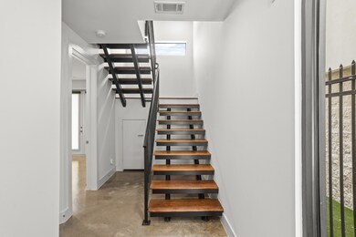 Upon entering is the first floor bedroom and stair