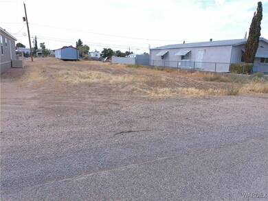 View of yard featuring a storage unit