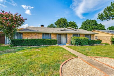 Single story home featuring a front yard