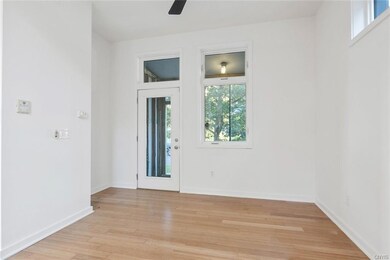 Front door entrance with thermostat, fan and light