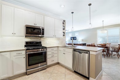 Open kitchen with peninsula.