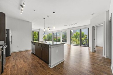 Kitchen featuring dark brown cabinets, a center is