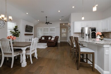 Dining room with lofted ceiling, recessed lighting