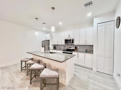 Kitchen featuring appliances with stainless steel