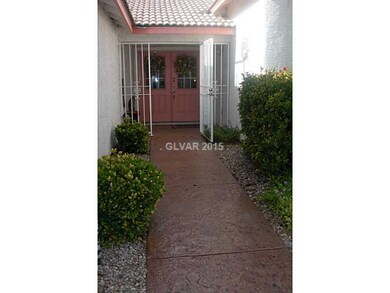 Facade/Exterior Front. Front Door W/ security Gate