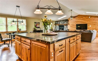 Huge kitchen island adds additional cabinetry.