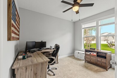 Conveniently located on the main level is a spacious office space or flex room.