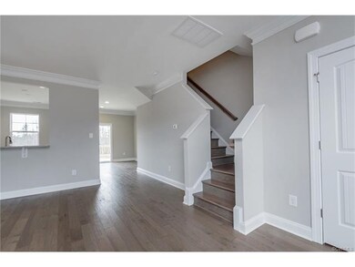 Family room.  Gray paint. Hardwood floors. Powder 