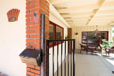Gate to covered patio and front door