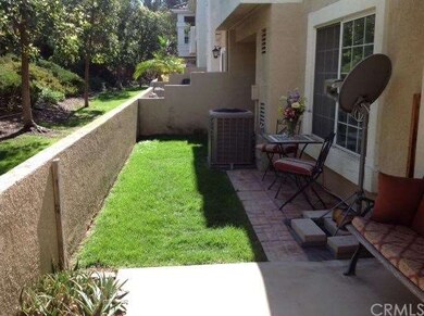 Combination patio for entertaining and grassy area
