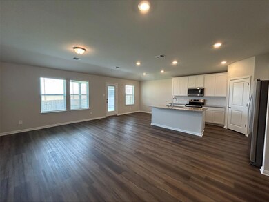 Kitchen featuring stainless steel appliances, ope