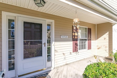 Doorway to property with covered porch