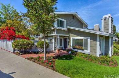 Paved brick entry and gorgeous landscaping.