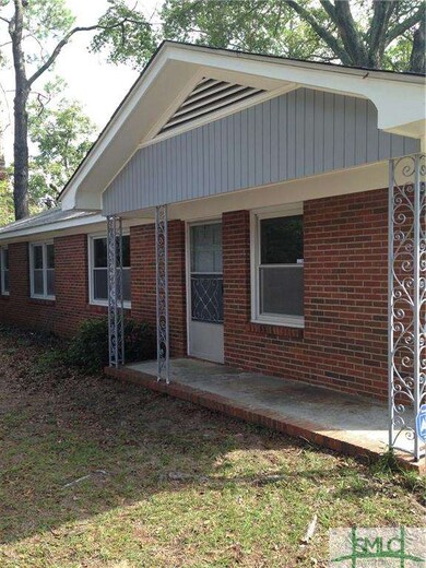 Side Entry from Covered Porch. Beautiful Wrought I
