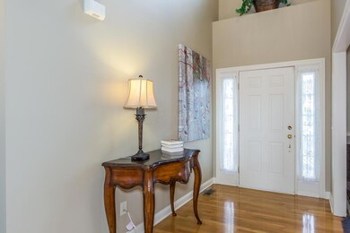 Two story foyer with wood floors