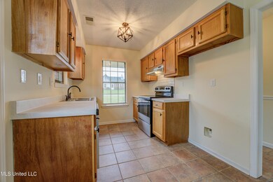View of Kitchen w/ Electric Stove and
