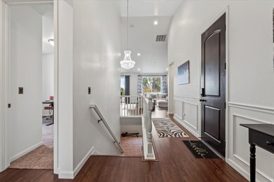 Entrance foyer with LVP flooring and recessed lighting