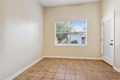 Dining area with tile floors, door to back yard