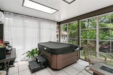 Lovely sunroom with hot tub.