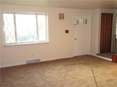 Living Room. The Front Door brings you into the Living Room, enhanced by a Large Front Window that fills the Room with Natural Light.