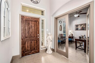 View of your front door and the home office.