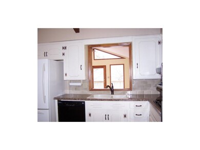 Window over sink overlooks the 4 season Sun Room