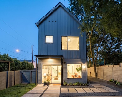 Rear view of property featuring board and batten 