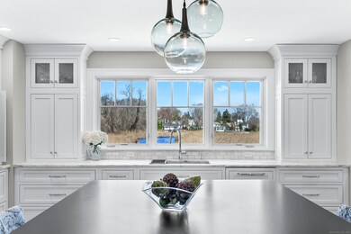 Gourmet chef's eat-in kitchen with unobstructed wa