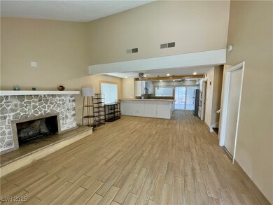 Unfurnished living room featuring a towering ceili