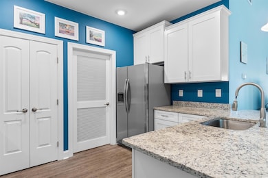 Kitchen featuring sink, light hardwood / wood-styl
