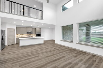 The Casual Dining flows into the Amazing Dramatic Family Area and the Gourmet Kitchen! Come and see this New D.R. Horton Home! A Wall of Windows brightens the Family Area!