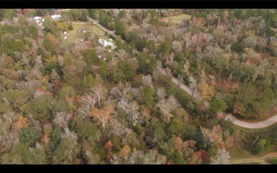 Back view of the property with a peek of the neighbor to your left.