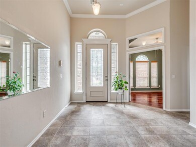 Entrance foyer with light hardwood / wood-style fl