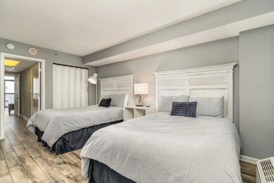 Bedroom featuring baseboards and tile finished flo